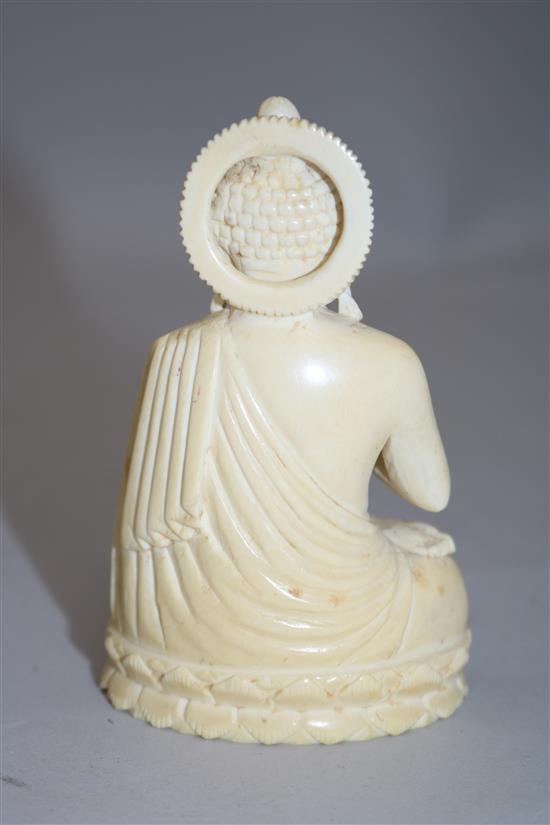 A Chinese ivory seated figure of Buddha Shakyamuni, early 20th century, 11cm